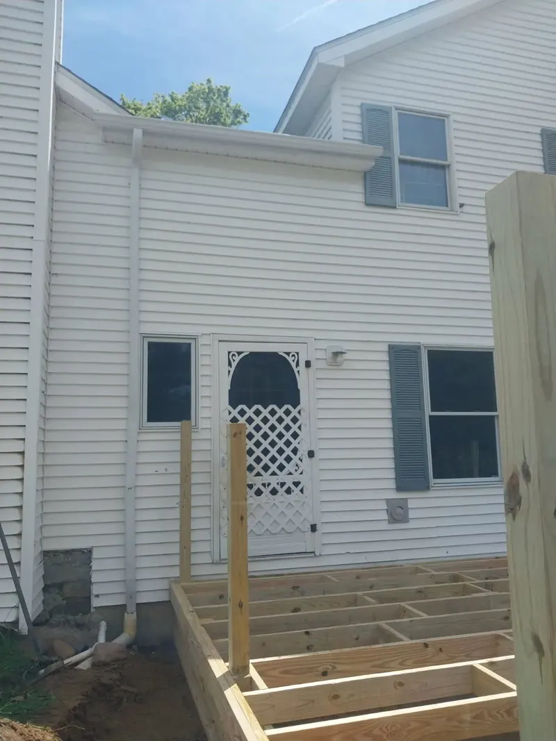 New seamless gutters and downspout on a two-story colonial