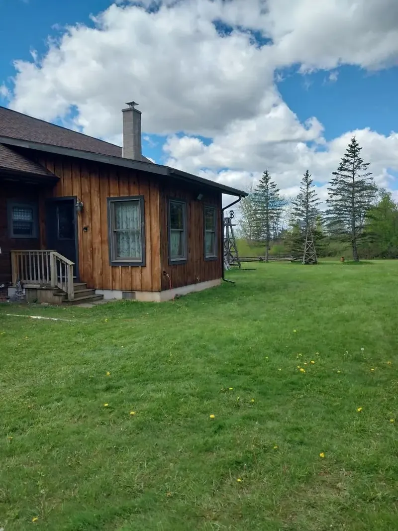 Log home with a resealed and refinished metal roof