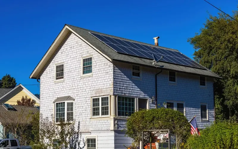 Asphalt shingle roof treated to extend its life