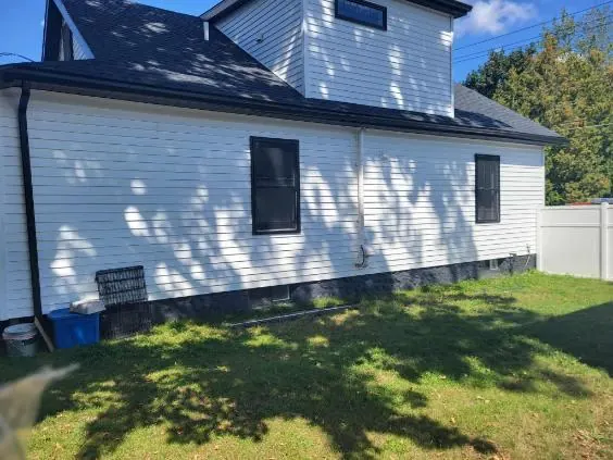 New siding, trim and gutters on a two-story home
